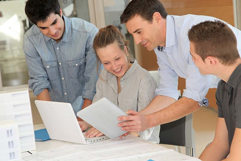 Students in architecture working on electronic tablet